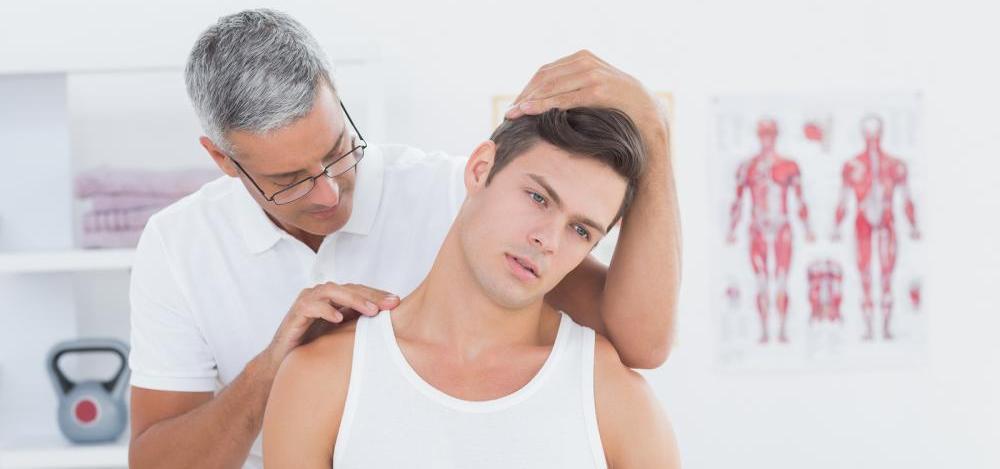 bigstock-Doctor-doing-neck-adjustment-i-85571075